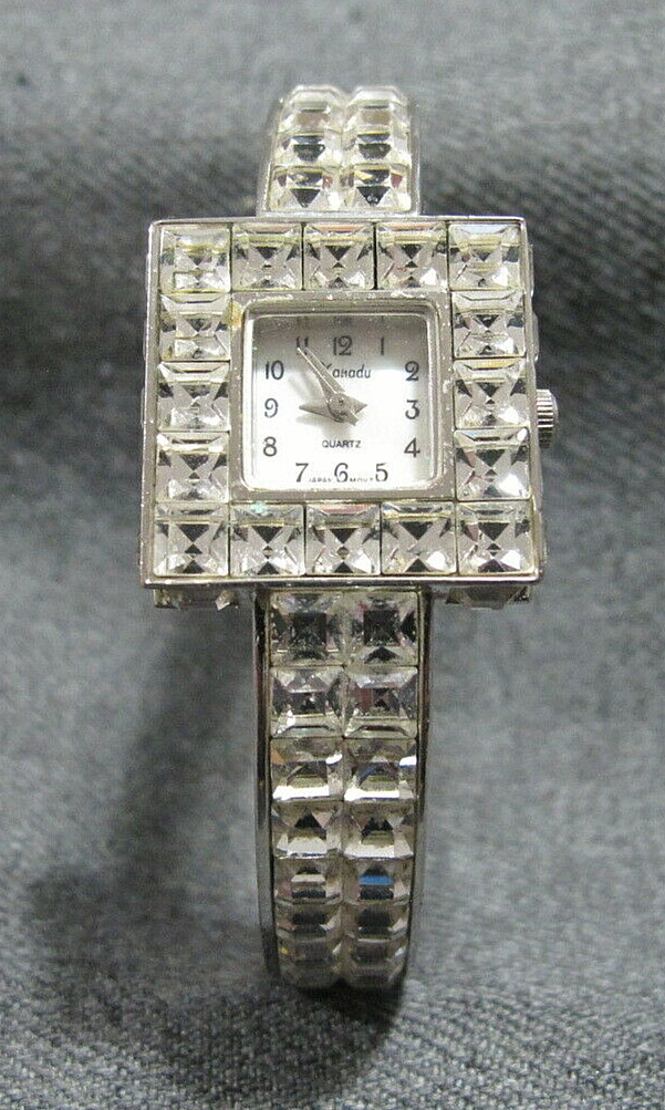 Xanadu MOP dial  clear mineral crystal silvertone metal hinged watch