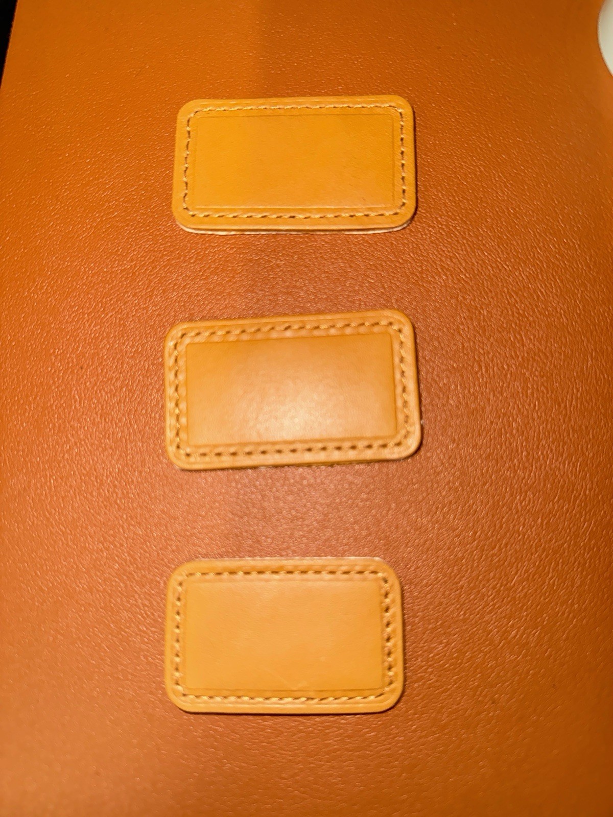 Tumi Tan Monogram Patches Leather