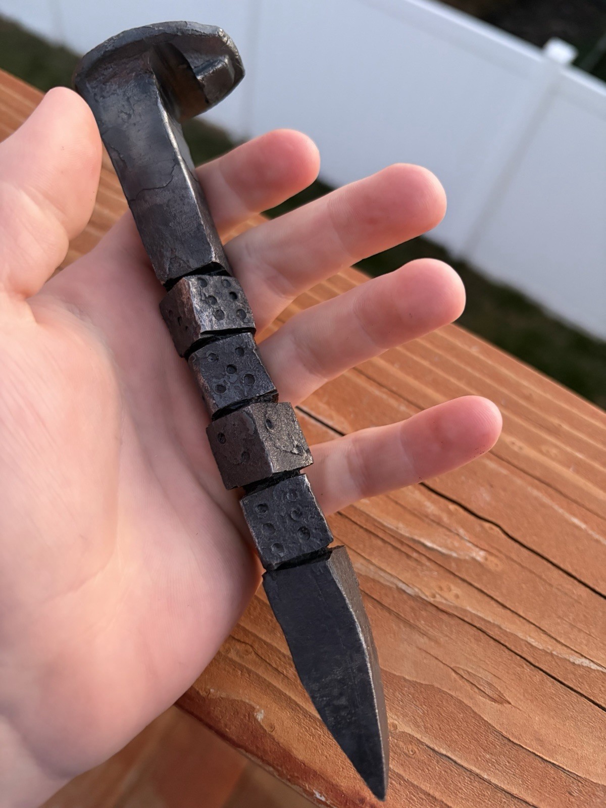 Hand forged railroad spike bottle opener