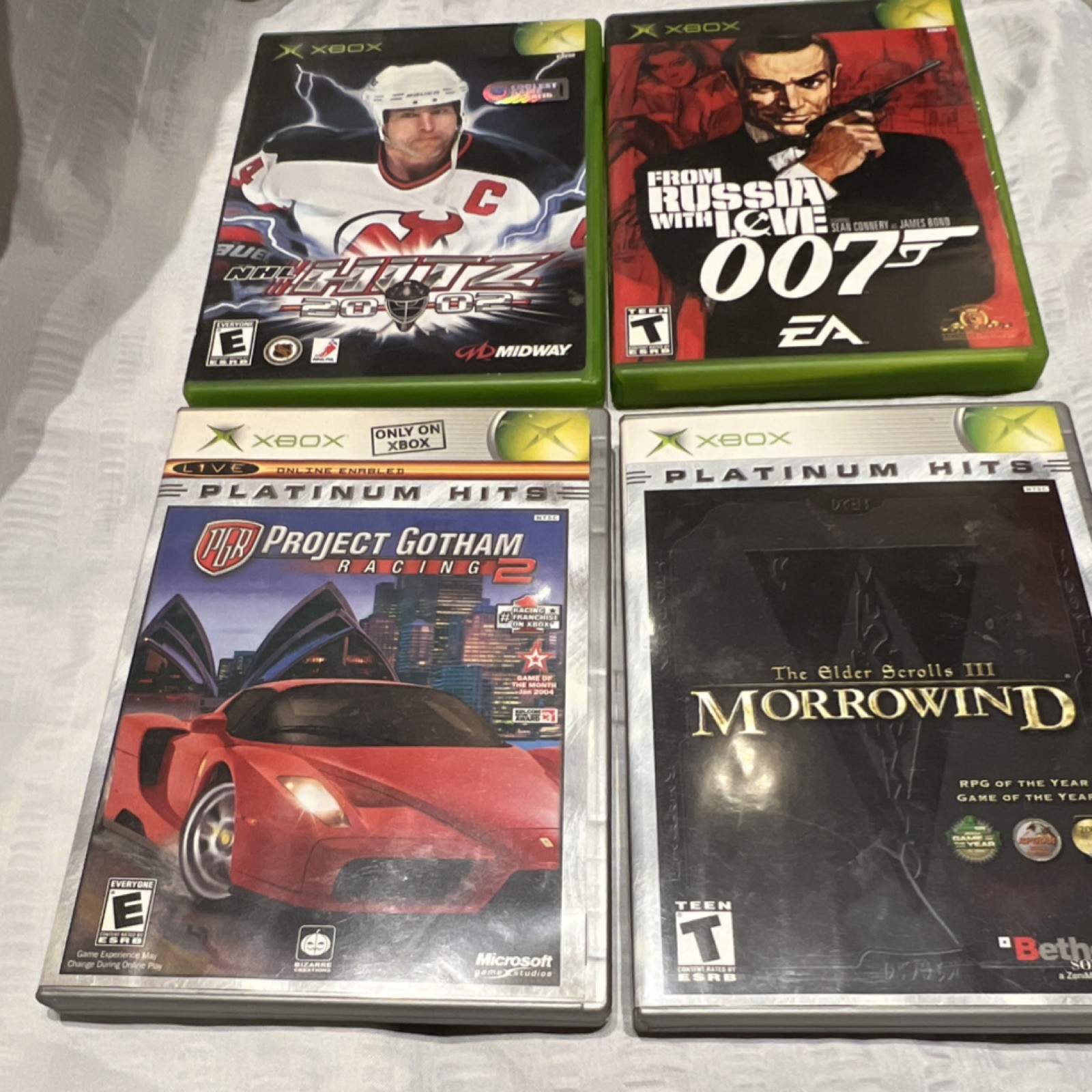 Microsoft, EA Sports, Midway Xbox Game Lot - Morrowind, Racing, 007, Manuals