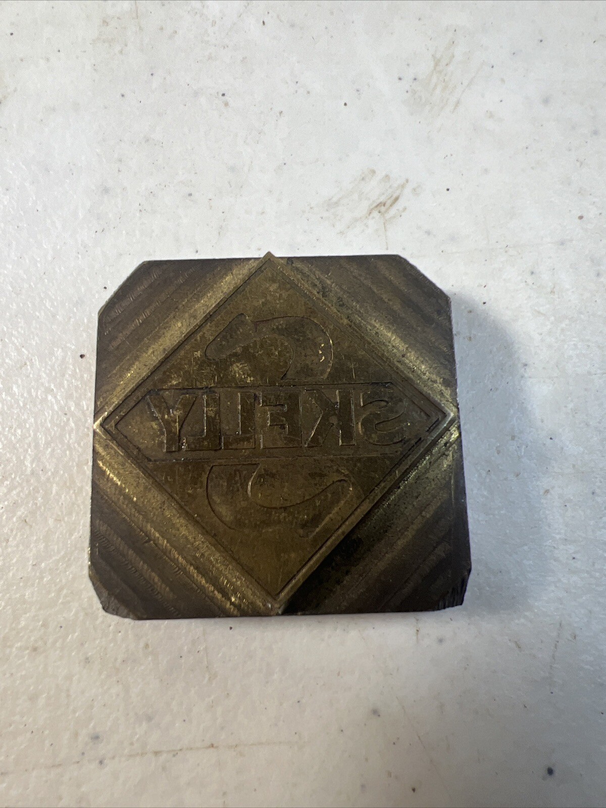 Vintage Letterpress Printing Block Skelly Advertising Logo