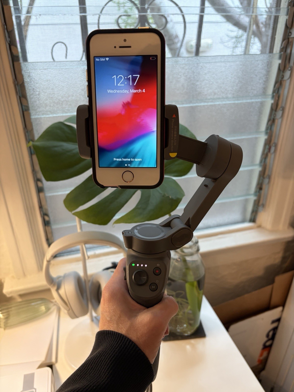 DJI Osmo Mobile 3, a foldable handheld gimbal designed for smartphones.