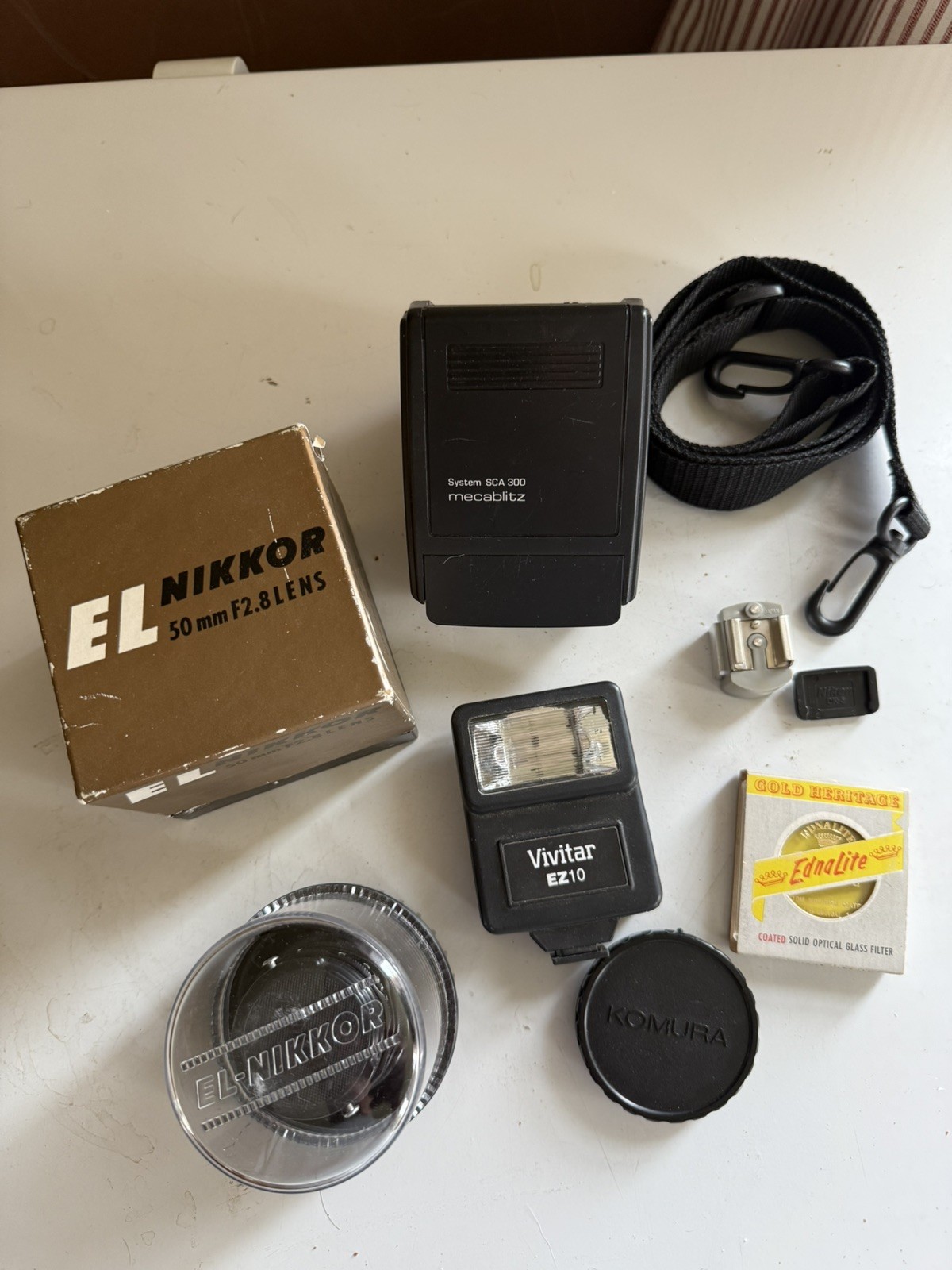 Make $.  Buy this LOT of photo gear and resell! Just look at these! 