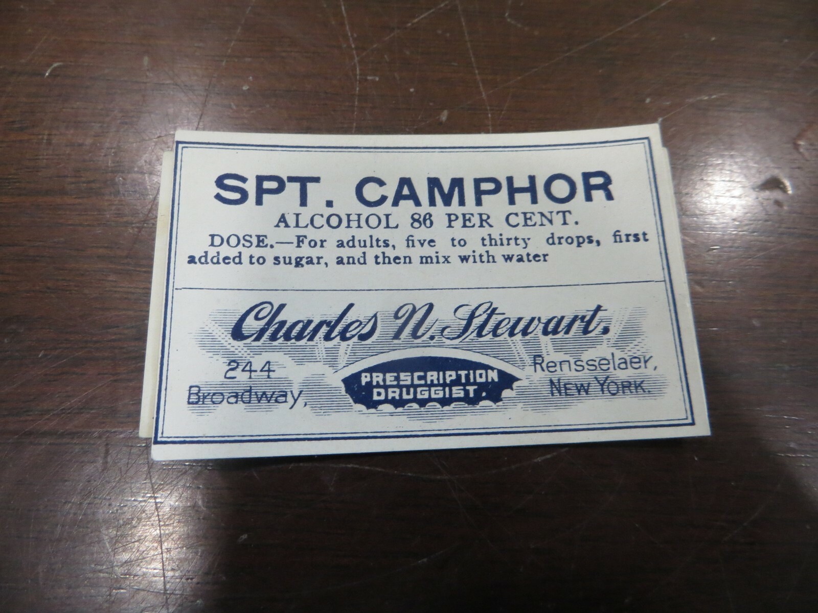 SPT.CAMPHOR,CHARLES N.STEWART,PRESCRIPTION DRUGGIST PAPER BOTTLE LABEL