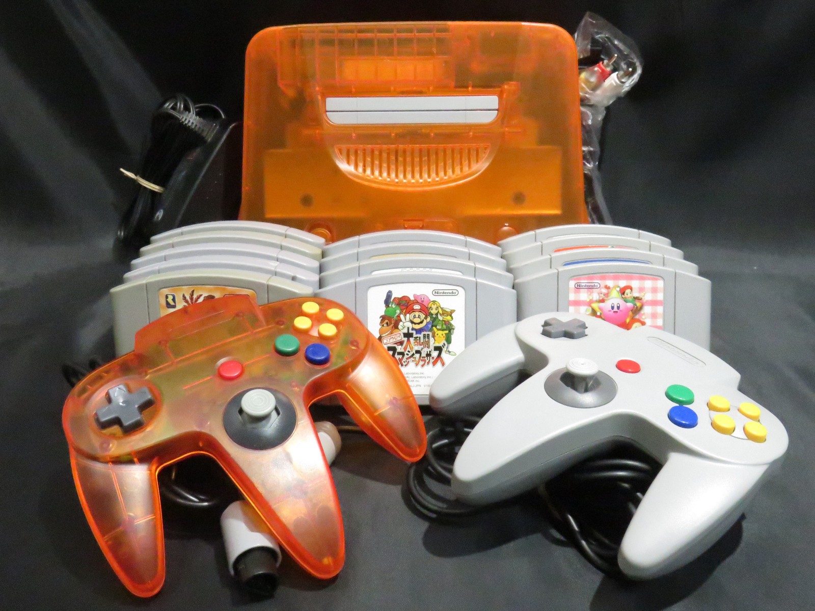 Nintendo 64 Console (Clear Orange ver.) + 13 games ( Mario, Kirby ) set