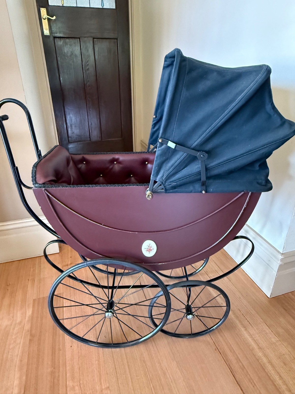 vintage doll carriage pram in burgundy