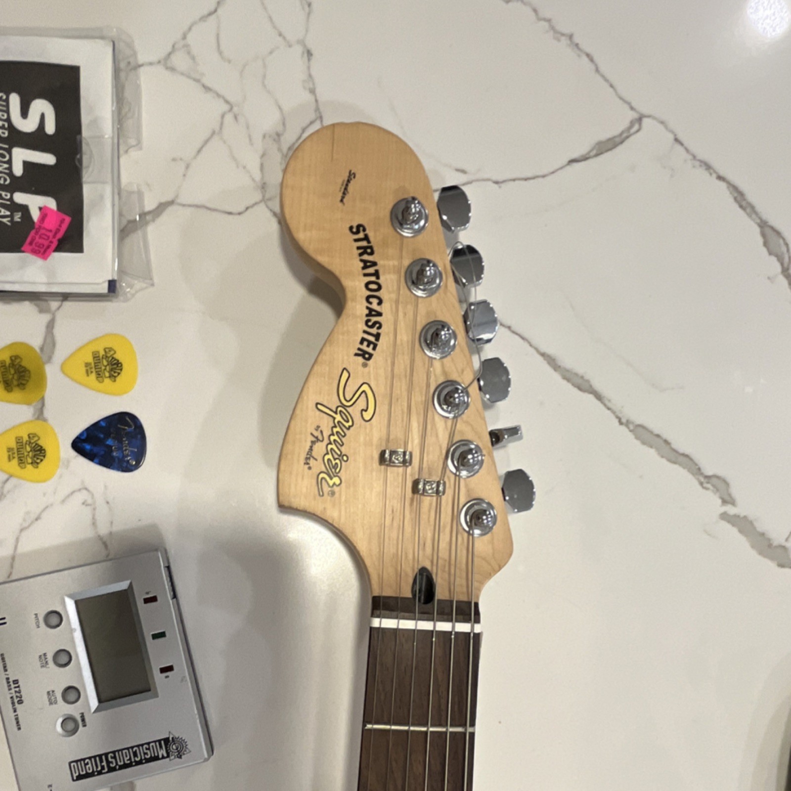 Squier by Fender Stratocaster Electric Guitar Black w/Gig Bag, Cable,Picks,tuner