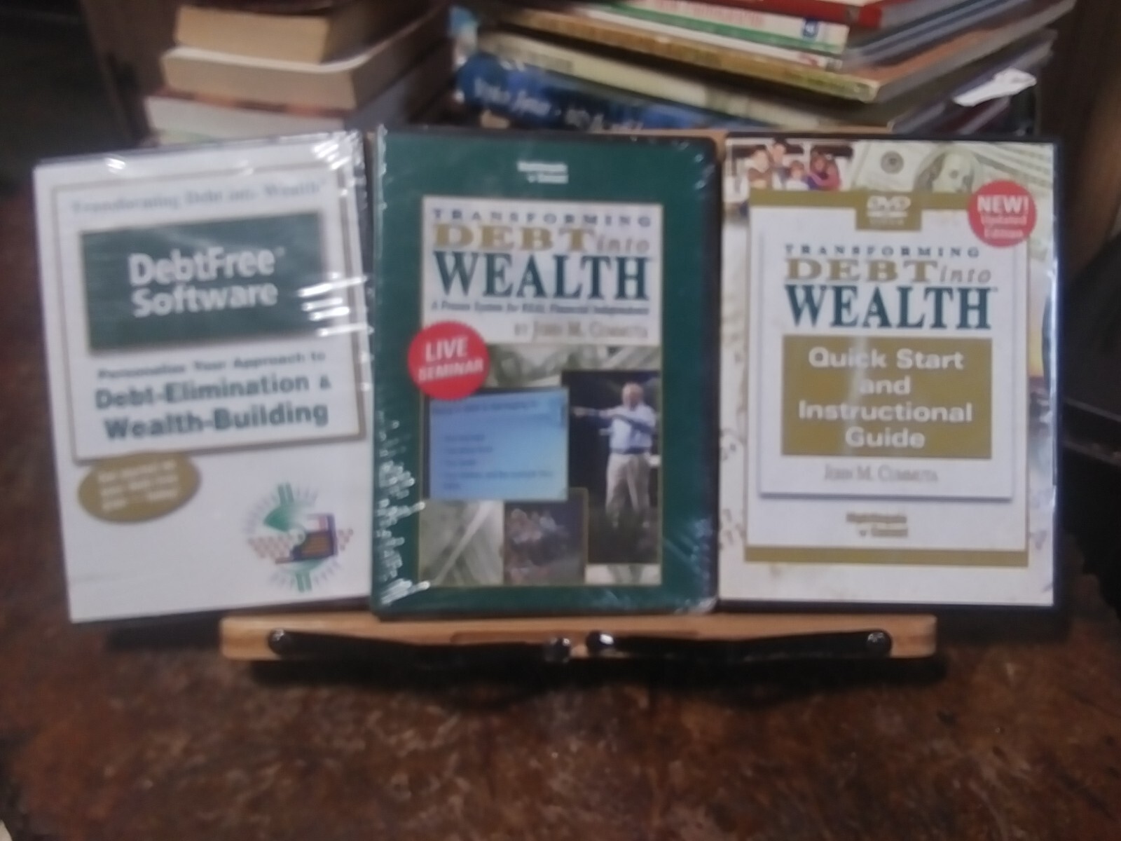 set of 3 Transforming Debt into wealth DVD's By Jon . m cummuta