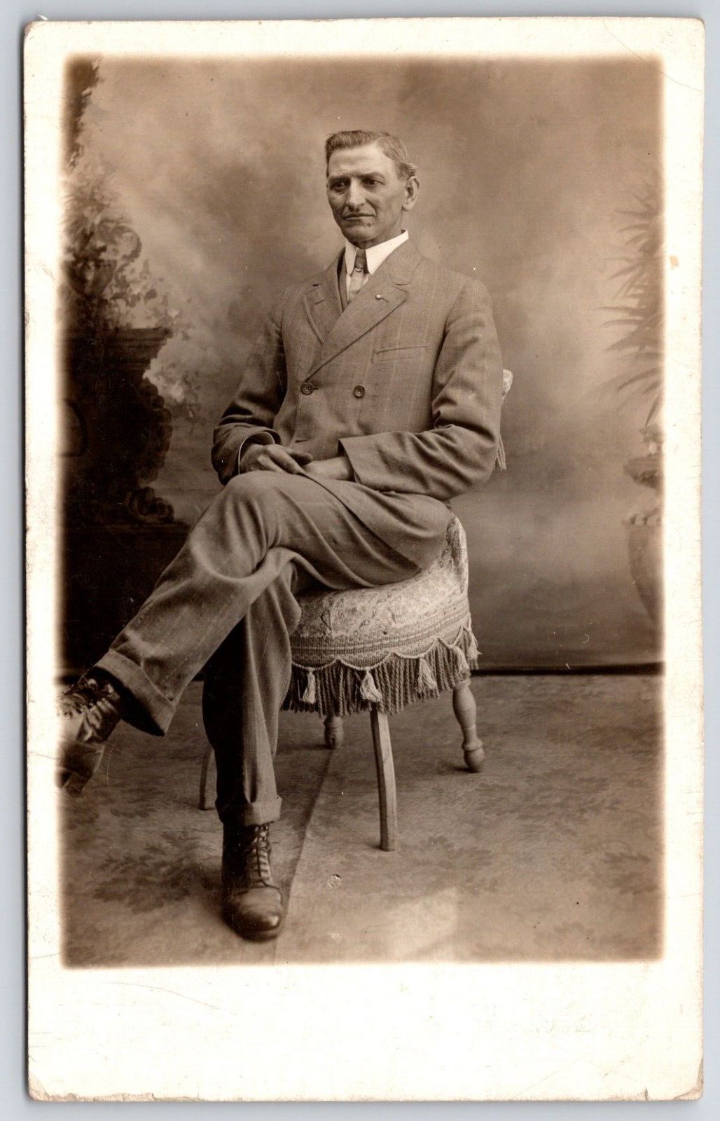 Man Dressed in Suit Sitting on Chair Portrait RPPC Postcard Real Photo