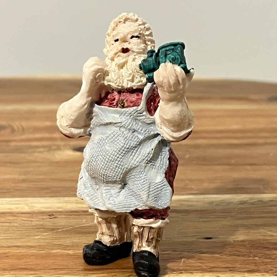 vintage resin figurine little santa fixing a train  blue apron miniature 3.5"