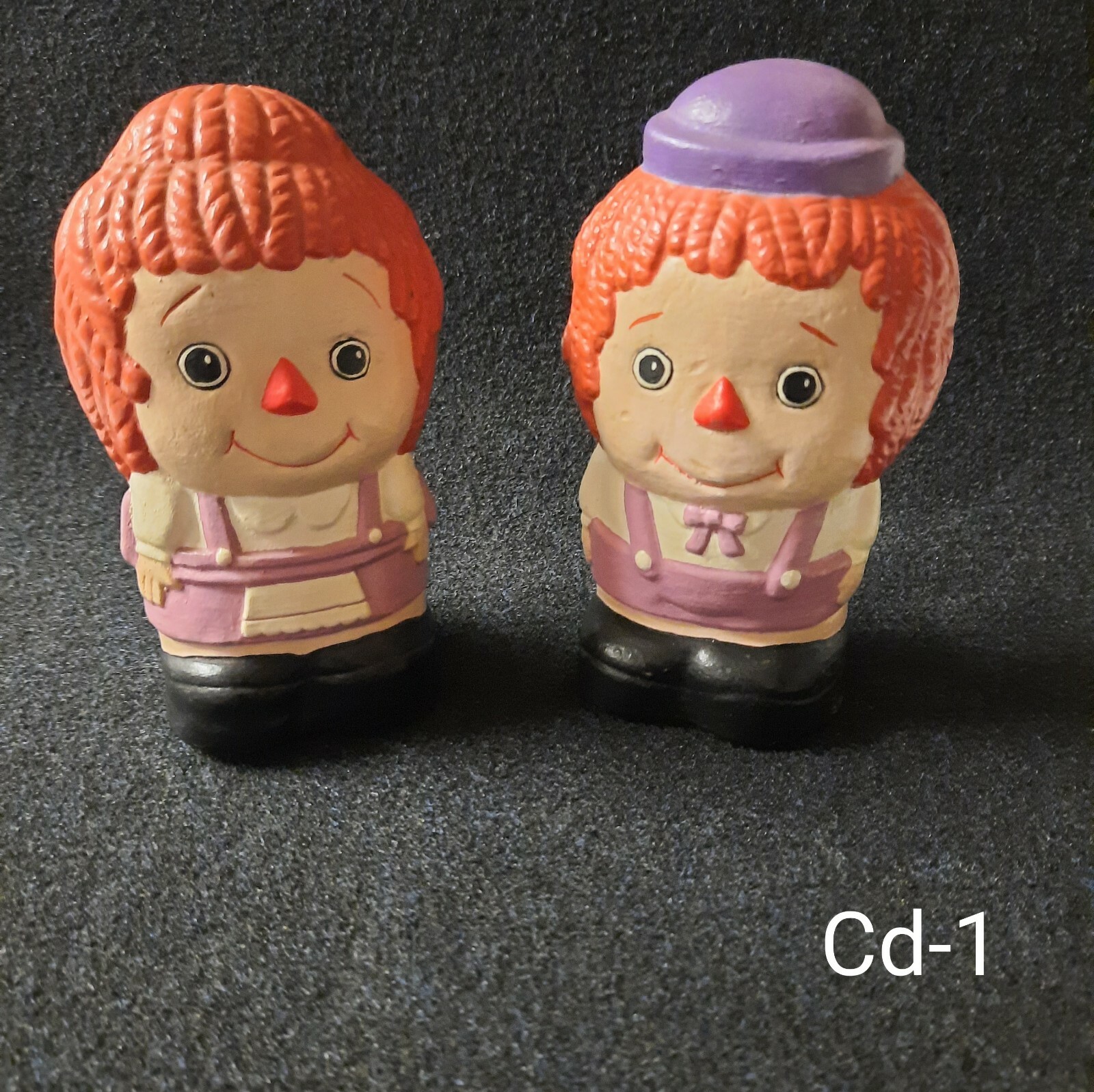 vintage Raggedy Ann and Raggedy Andy chalk figurines.        