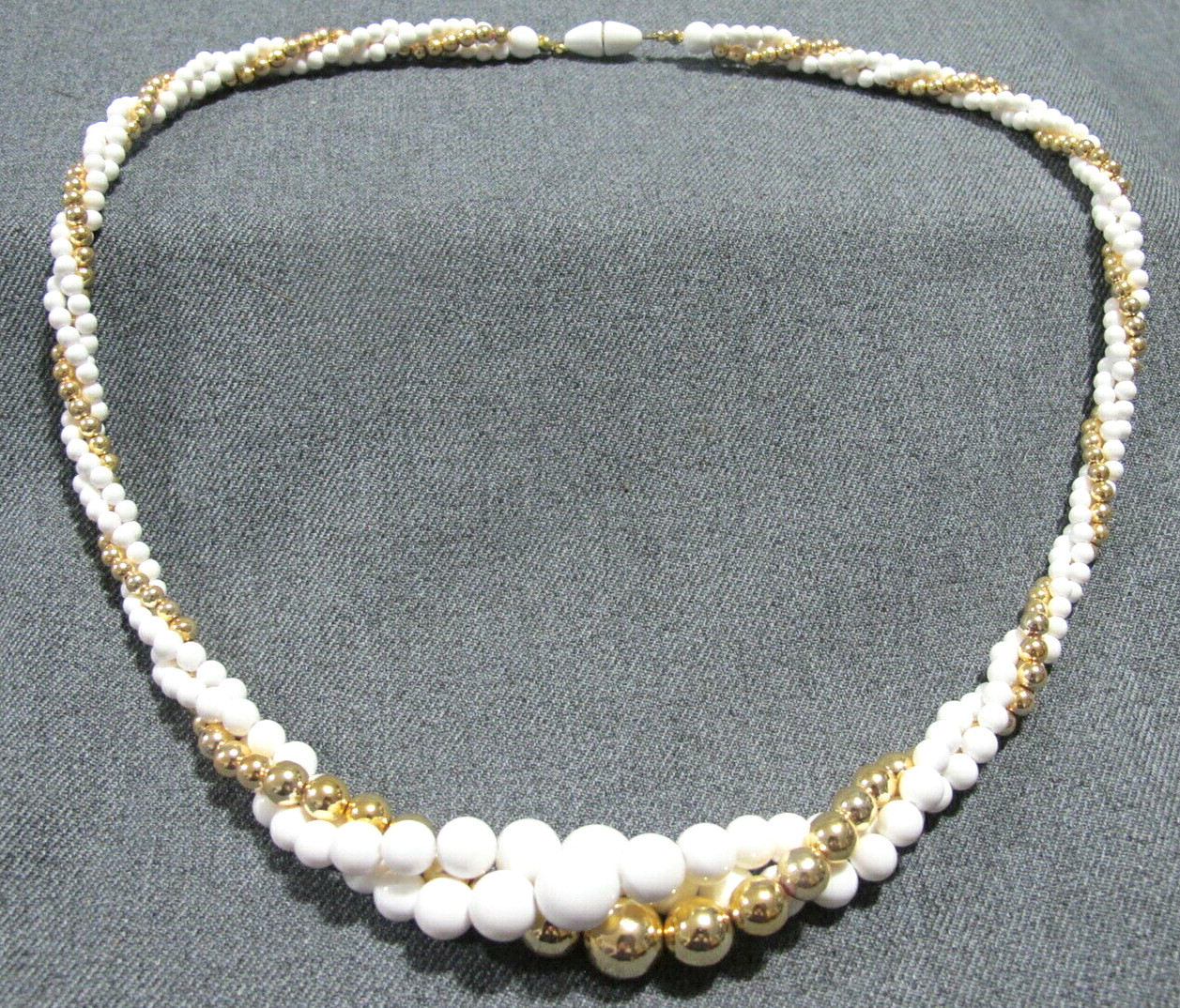 Vintage graduated white & goldtone plastic beads twisted 3 strands necklace
