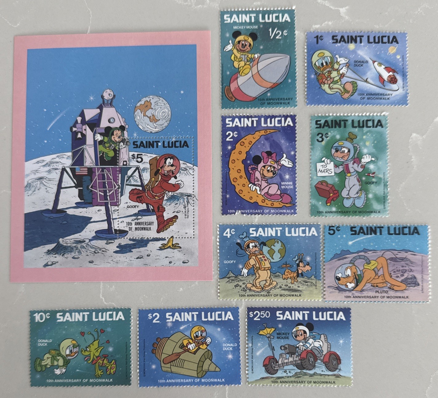 ST. LUCIA DISNEY STAMPS-1 souvenir sheet-1 set of 9 stamps-MNH-See description