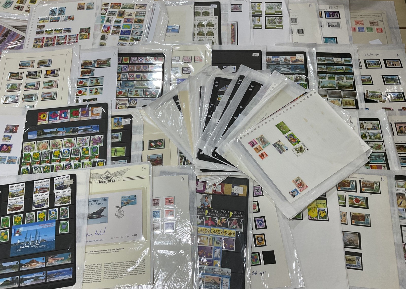 Jersey stamps. Ex dealer leaves/cards. Mint/used likely, as shown. 1.5kg. G38