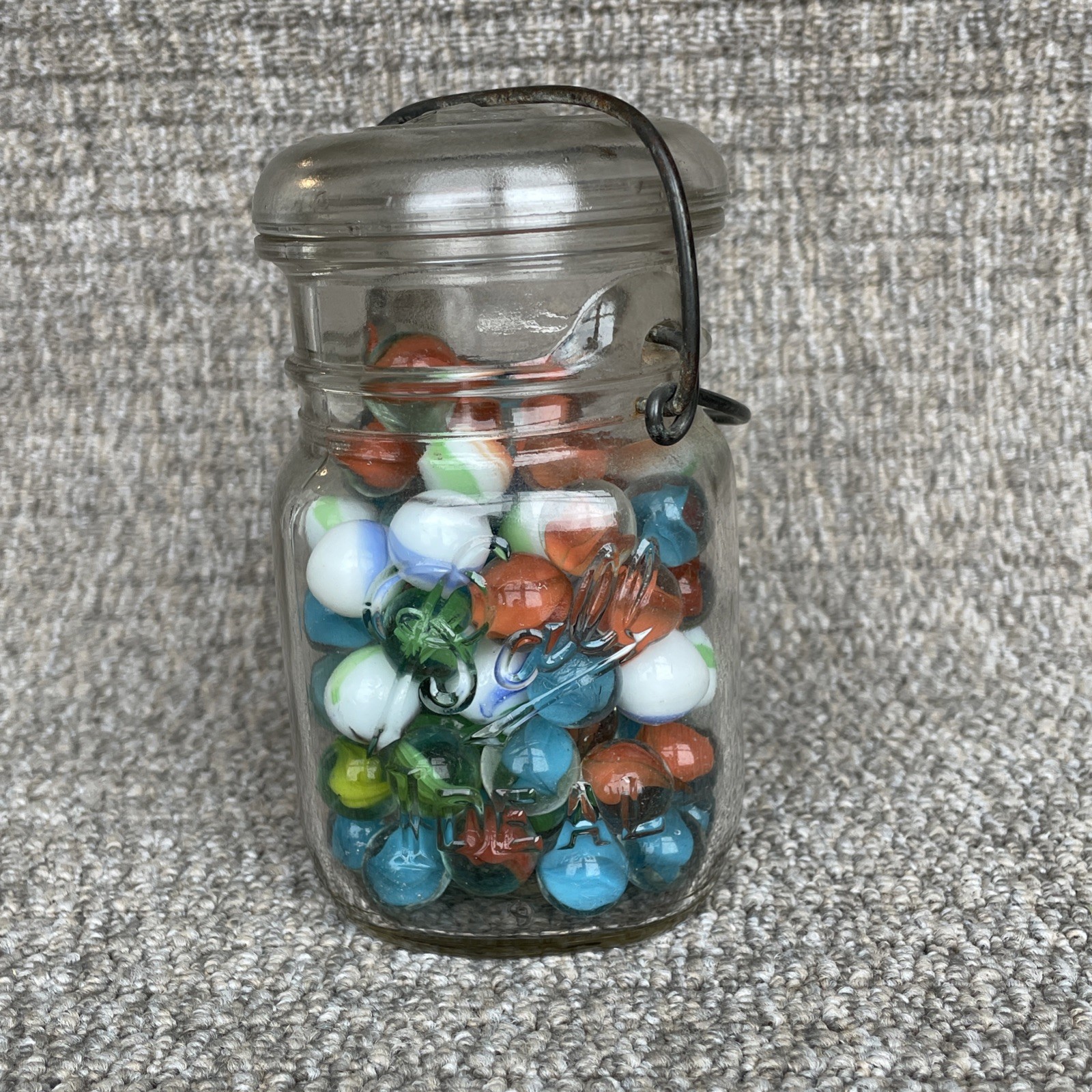 Vintage  Glass Ball Ideal Jar Filled With Marbles.  Jar Is 5 1/2” Tall.