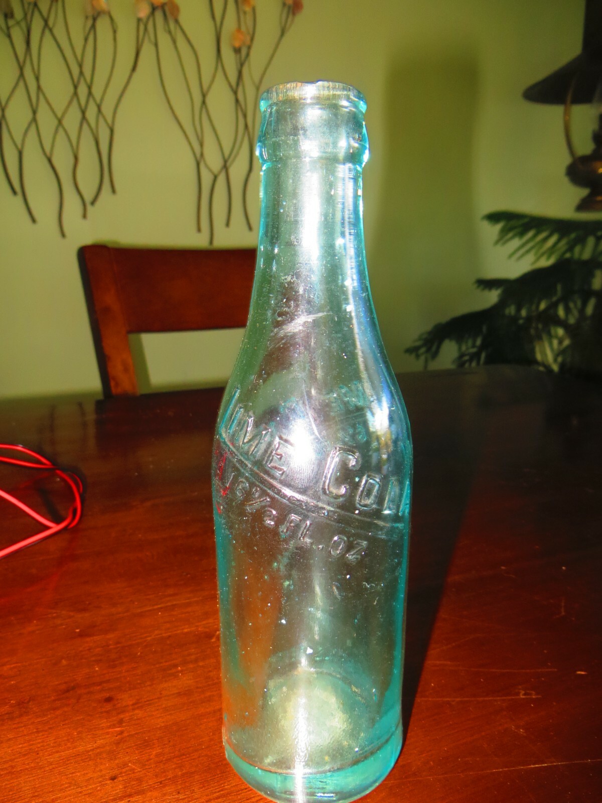 Lime Cola 6 1/2 fl oz aqua blue bottle, embossed says this bottle never sold