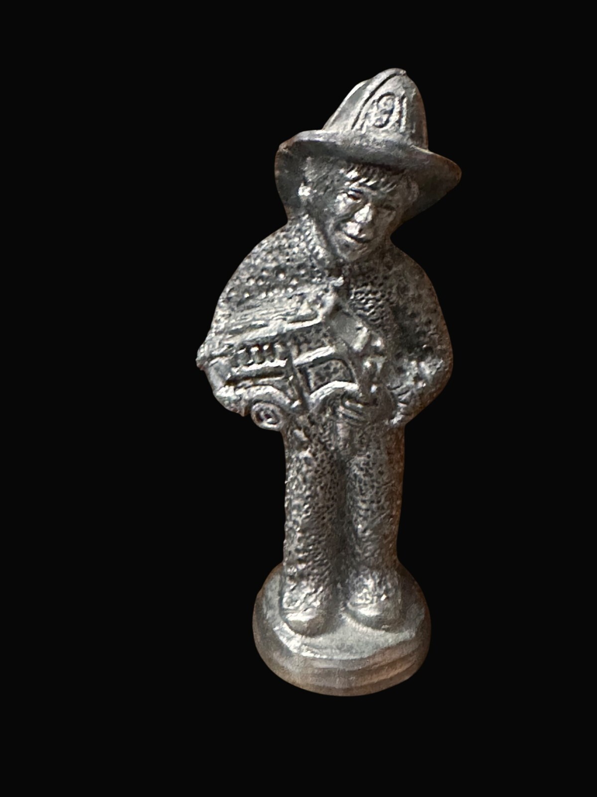 Pewter Michael Ricker child Figurine 2002 Holding Fire Truck & fireman helmet