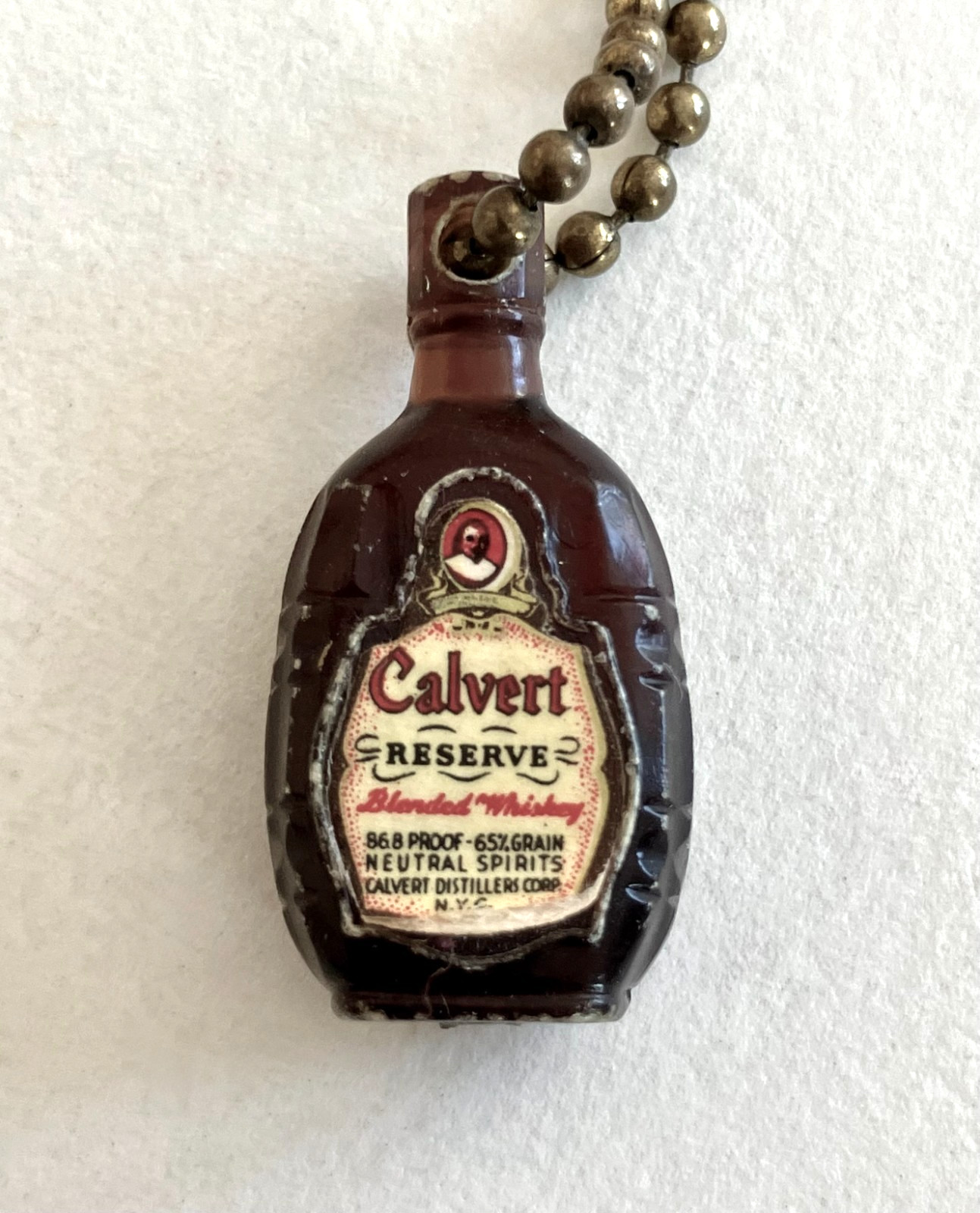 Vintage key chain with liquor bottle