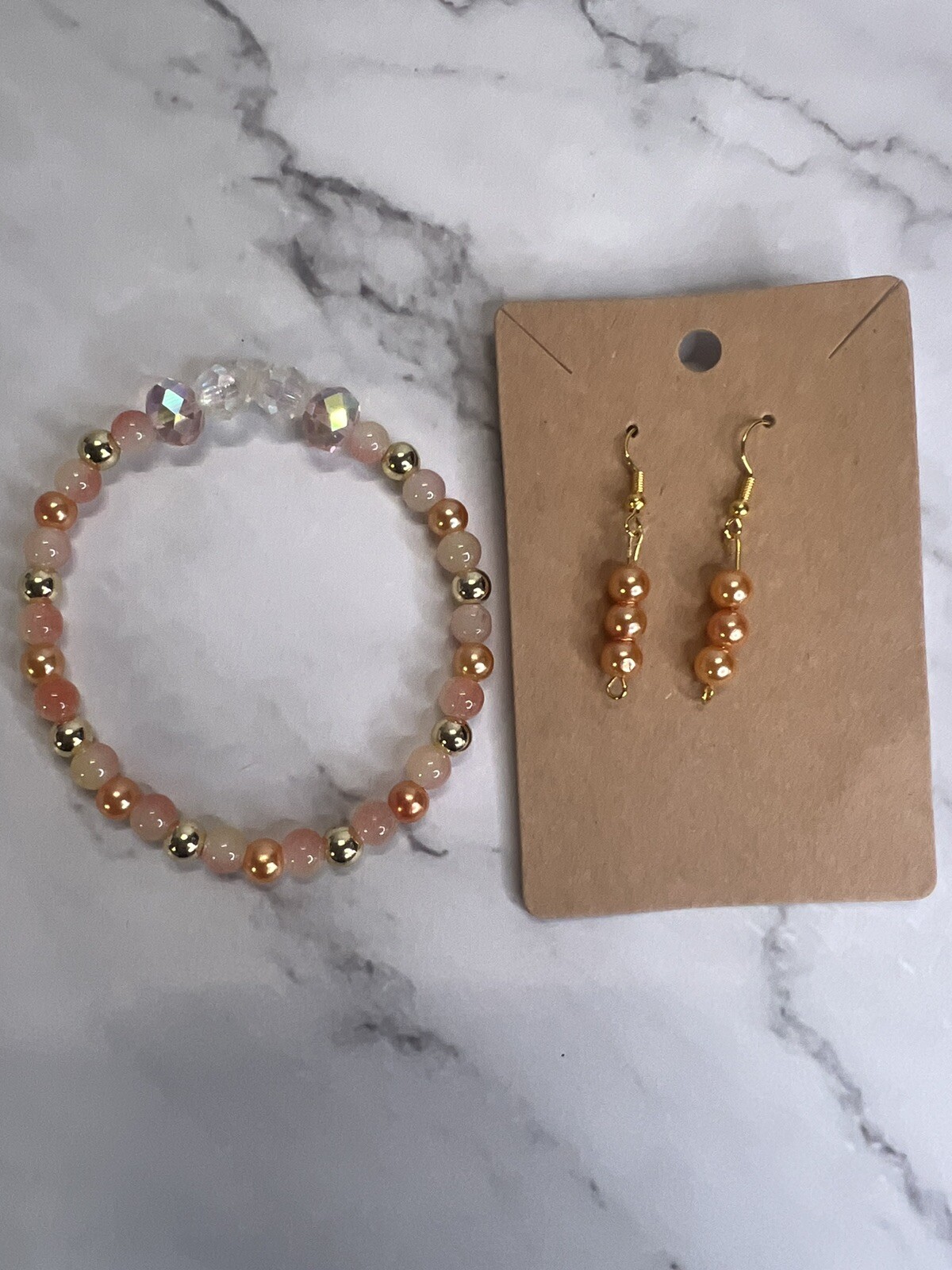 handmade beaded dainty dangle earrings and bracelet set peach and gold tones