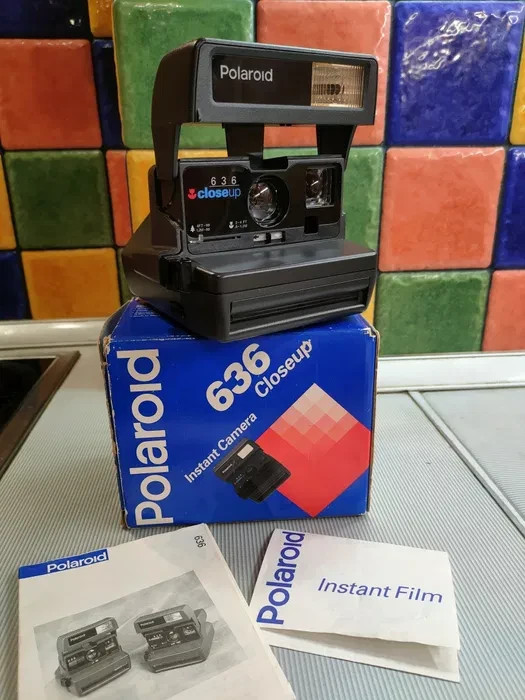 In the original Polaroid box with documents in new condition