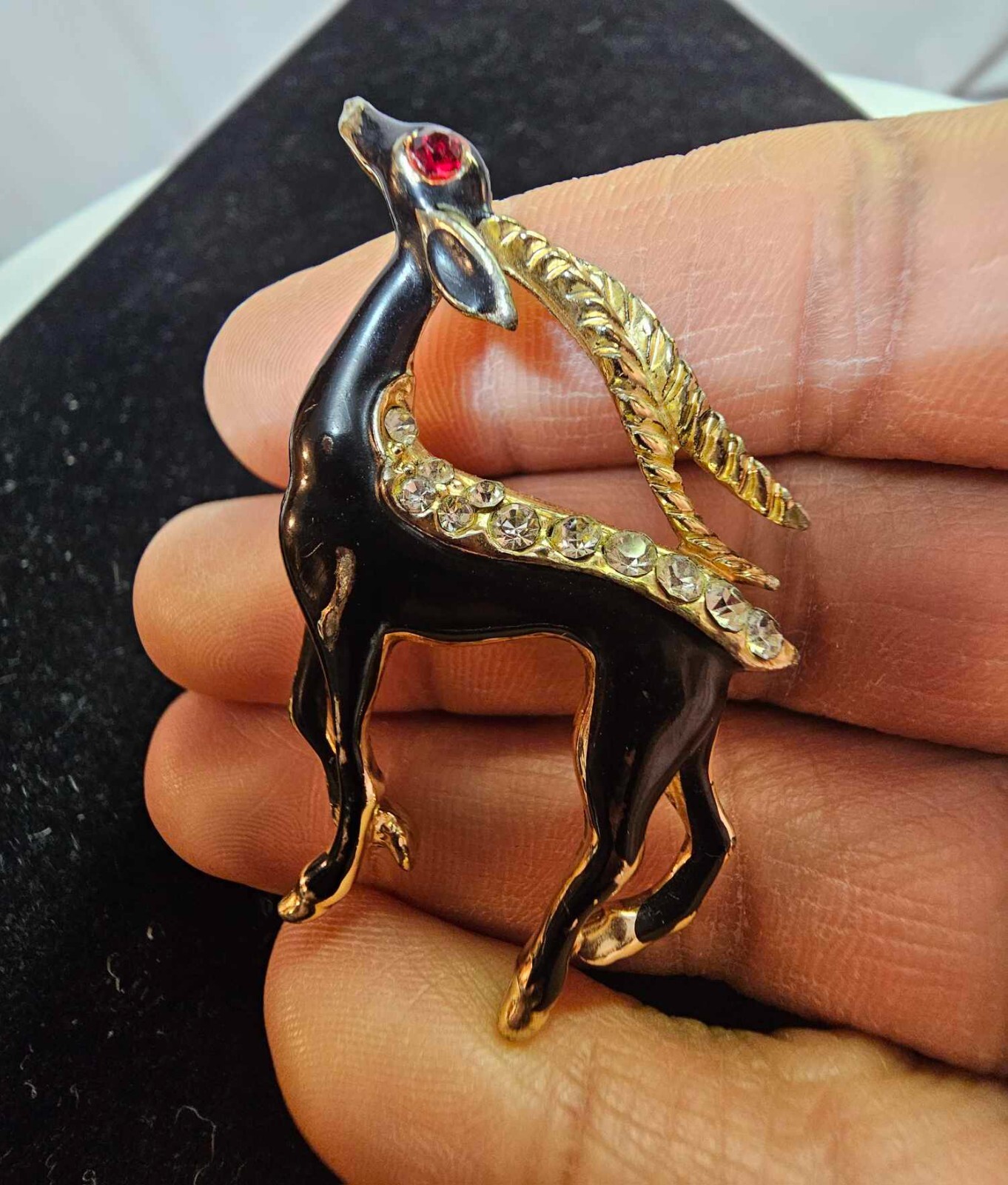 Vtg Goldtone antelope/gazelle brooch pin w black enamel clears stone red eye-S81
