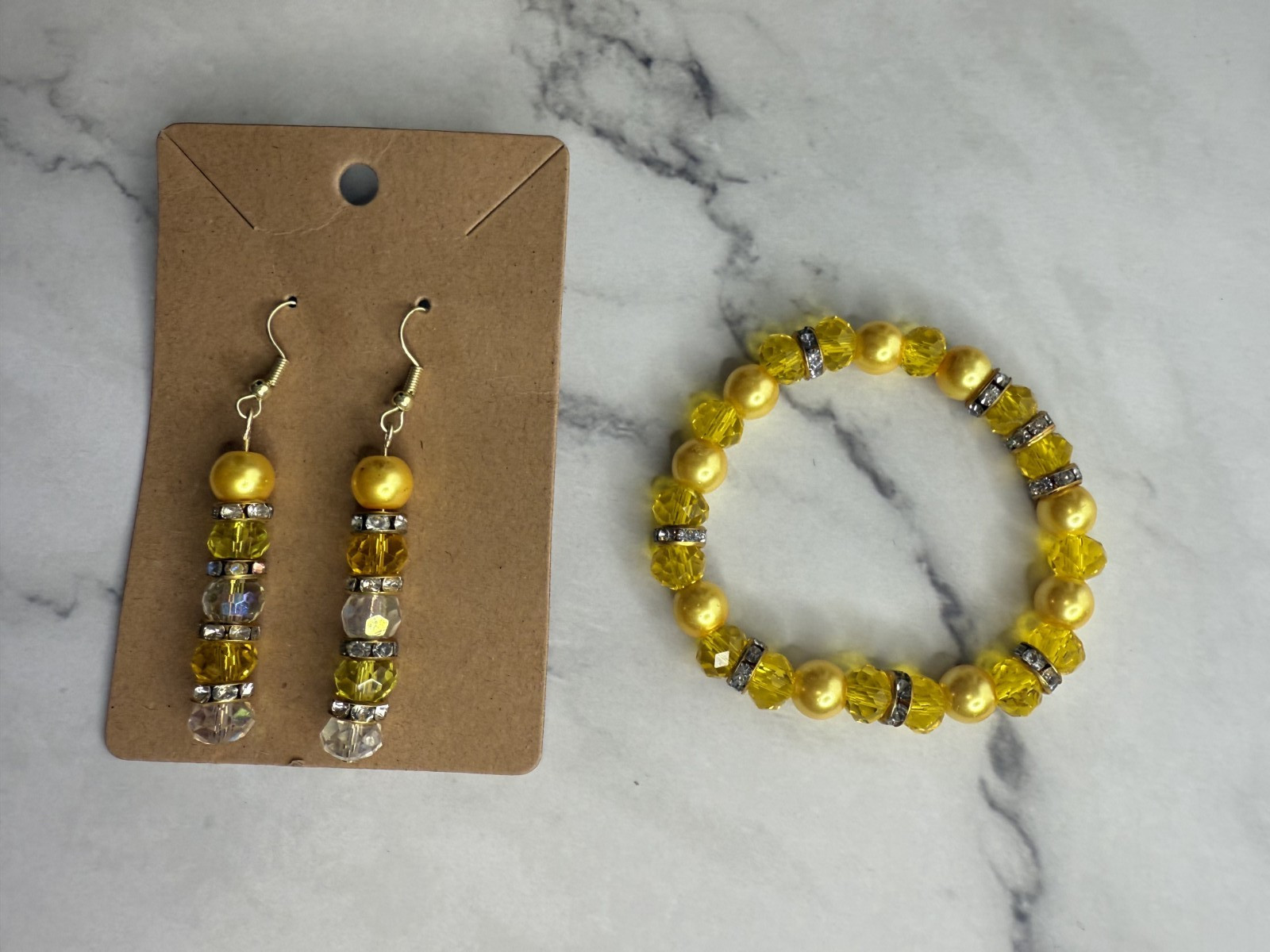 handmade beaded dangle earrings and bracelet yellow and clear tones
