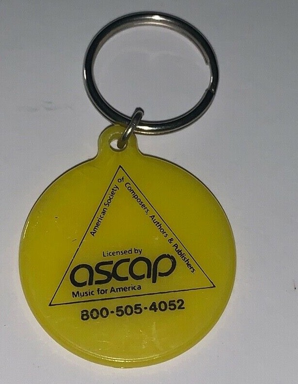 Vintage Advertising KEYCHAIN YELLOW CIRCULAR ASCAP MUSIC FOR AMERICA
