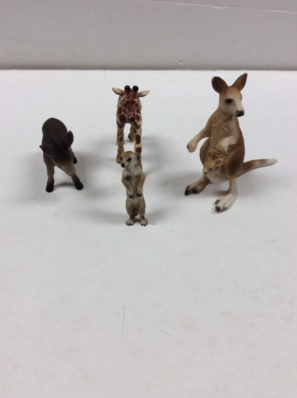 SCHLEICH ANIMALS Lot of 4  kangaroo, giraffe, meerkat & donkey