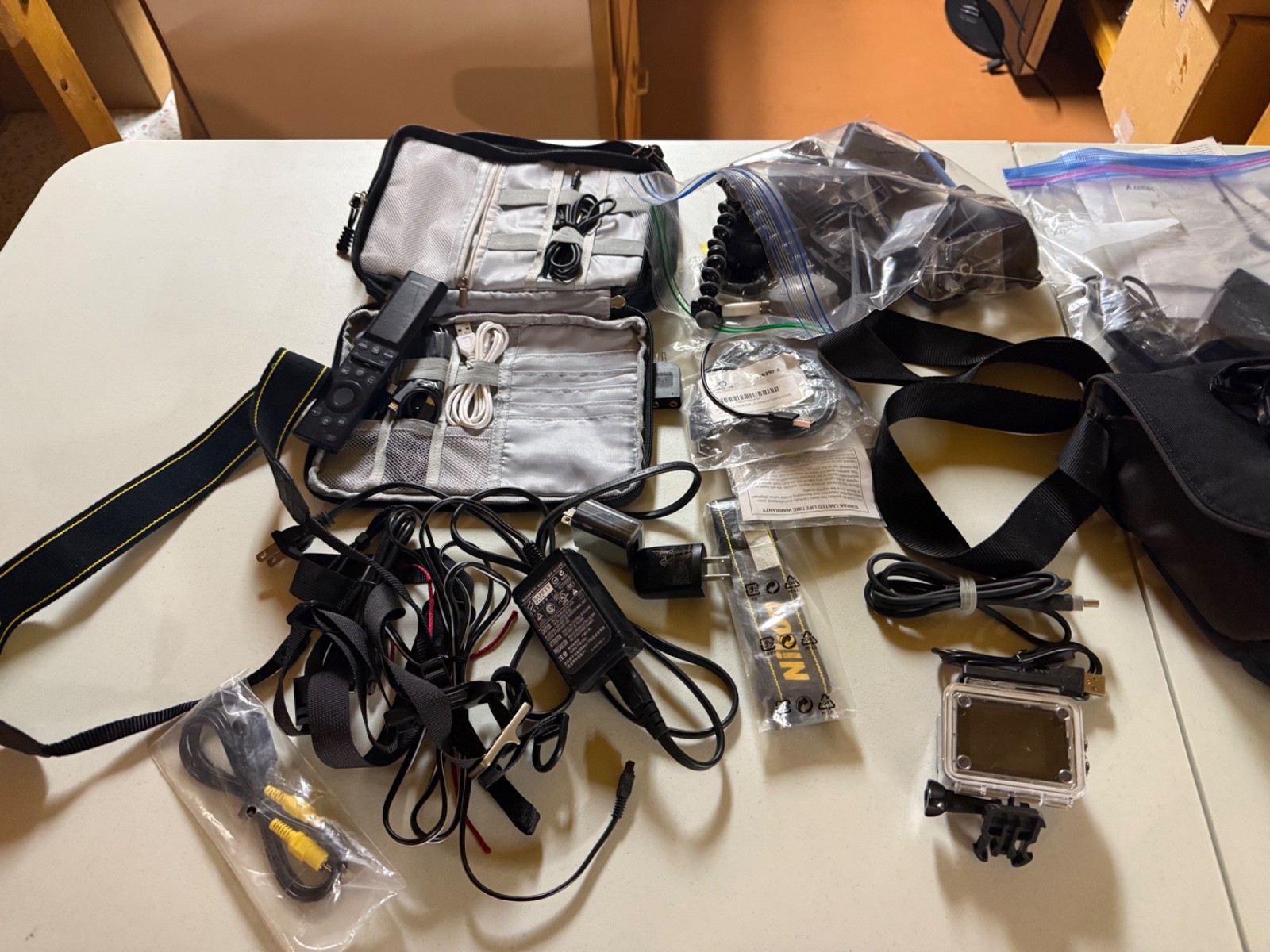 Lot of camera equipment, lens, cameras, cases, and stand